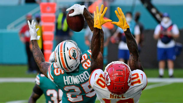 Dec 13, 2020; Miami Gardens, Florida, USA; Miami Dolphins cornerback Xavien Howard (25) makes a one handed catch to intercept a pass intended for Kansas City Chiefs wide receiver Tyreek Hill (10) during the second half at Hard Rock Stadium. Mandatory Credit: Jasen Vinlove-USA TODAY Sports